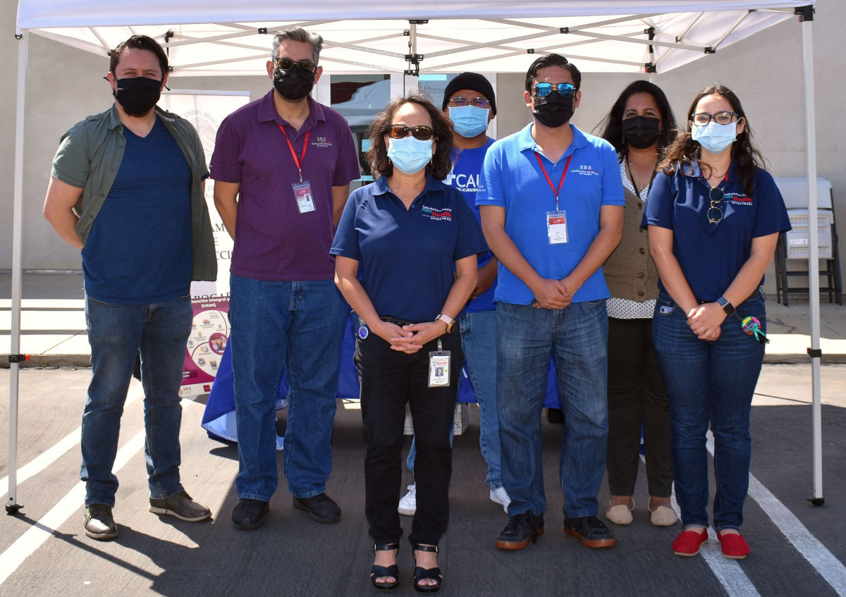 Santa Barbara County Health director Van Do-Reynoso poses with members of CAUSE and SRE Consulate of Mexico Oxnard at the mobile clinin on Sunday.